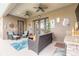 Inviting covered patio with wicker furniture, ceiling fans, and stylish decor for outdoor relaxation at 2939 Bella Flore Ter, New Smyrna Beach, FL 32168
