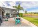 Cozy outdoor patio area with comfortable seating and golf course view at 2939 Bella Flore Ter, New Smyrna Beach, FL 32168