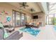 Outdoor patio with ceiling fans, comfortable seating, and outdoor kitchen perfect for entertaining at 2939 Bella Flore Ter, New Smyrna Beach, FL 32168