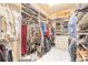 Organized walk-in closet with ample shelving, clothing racks, and drawer storage at 2939 Bella Flore Ter, New Smyrna Beach, FL 32168