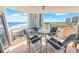 Balcony view with table and chairs, overlooking the ocean and city skyline at 2967 S Atlantic Ave # 508, Daytona Beach, FL 32118