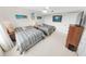Light bedroom with two beds, soft carpet, ceiling fan, and a window view at 2967 S Atlantic Ave # 508, Daytona Beach, FL 32118