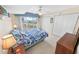 Bedroom with a ceiling fan, and three closets and a balcony at 2967 S Atlantic Ave # 508, Daytona Beach, FL 32118