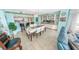 Dining area with seating for six, a bar area, and views into the open kitchen at 2967 S Atlantic Ave # 508, Daytona Beach, FL 32118