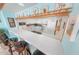 Well-lit kitchen area with a breakfast bar and decorative display shelf at 2967 S Atlantic Ave # 508, Daytona Beach, FL 32118