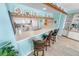 Modern kitchen featuring a breakfast bar and charming decorative plate rack at 2967 S Atlantic Ave # 508, Daytona Beach, FL 32118