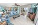 Inviting living room featuring an open floor plan with a bar, tile flooring, and scenic views at 2967 S Atlantic Ave # 508, Daytona Beach, FL 32118