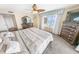 Spacious main bedroom featuring a ceiling fan, view and large dressers at 2967 S Atlantic Ave # 508, Daytona Beach, FL 32118
