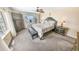Comfortable main bedroom with balcony access, ceiling fan and dressers at 2967 S Atlantic Ave # 508, Daytona Beach, FL 32118
