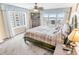 Inviting main bedroom with balcony access, ceiling fan and dresser at 2967 S Atlantic Ave # 508, Daytona Beach, FL 32118