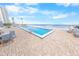 Outdoor pool with ocean view, surrounded by brick patio and seating areas at 2967 S Atlantic Ave # 508, Daytona Beach, FL 32118
