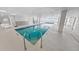 Well-lit indoor pool featuring sleek design, ocean views, and a modern aesthetic at 2967 S Atlantic Ave # 508, Daytona Beach, FL 32118