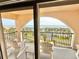 Charming balcony with rocking chairs, offering relaxing ocean views at 30 Inlet Harbor Rd # 606, Ponce Inlet, FL 32127