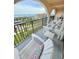 Spacious balcony featuring comfortable chairs, perfect for relaxing and enjoying the view at 30 Inlet Harbor Rd # 606, Ponce Inlet, FL 32127
