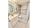 Stylishly renovated bathroom with shower/tub combo and vanity with white cabinets at 30 Inlet Harbor Rd # 606, Ponce Inlet, FL 32127