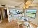 Cozy dining area next to the kitchen, bathed in natural light, perfect for intimate gatherings, and scenic outdoor views at 30 Inlet Harbor Rd # 606, Ponce Inlet, FL 32127