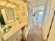 Dressing area with vanity, lighting, and access to the Primary bedroom with ocean view at 30 Inlet Harbor Rd # 606, Ponce Inlet, FL 32127