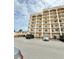 Multi-story condo building featuring multiple levels with stacked balconies and convenient parking at 30 Inlet Harbor Rd # 606, Ponce Inlet, FL 32127