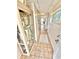 Hallway with tile flooring and decorated display case at 30 Inlet Harbor Rd # 606, Ponce Inlet, FL 32127