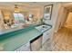 Charming kitchen with stainless steel appliances, seamlessly connected to the bright, inviting living space, and ocean view at 30 Inlet Harbor Rd # 606, Ponce Inlet, FL 32127