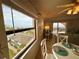 Living room view showcasing stunning beach vista, comfortably furnished interior, and access to a private balcony at 30 Inlet Harbor Rd # 606, Ponce Inlet, FL 32127