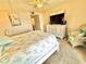 Well lit bedroom featuring decor and furnishings and a fan for warm nights at 30 Inlet Harbor Rd # 606, Ponce Inlet, FL 32127
