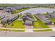 Aerial view of a home with a pond in a residential neighborhood at 3116 Crab Trap Dr, New Smyrna Beach, FL 32168