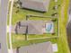 Aerial shot of backyard with screened pool and white perimeter fence at 3116 Crab Trap Dr, New Smyrna Beach, FL 32168