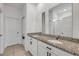 Bright bathroom features double sinks, granite countertops, and large mirrors at 3116 Crab Trap Dr, New Smyrna Beach, FL 32168