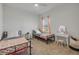 Cozy bedroom with two beds, a vanity with mirror, and a window at 3116 Crab Trap Dr, New Smyrna Beach, FL 32168