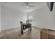 Bright bedroom featuring a ceiling fan, a work desk, and neutral carpet at 3116 Crab Trap Dr, New Smyrna Beach, FL 32168