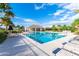 Relaxing community pool with lounge chairs and covered pavilion, perfect for outdoor enjoyment at 3116 Crab Trap Dr, New Smyrna Beach, FL 32168