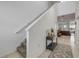Hallway featuring view into living area and stairs at 3116 Crab Trap Dr, New Smyrna Beach, FL 32168