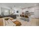 Open floor plan combining the kitchen and living spaces with modern appliances and a granite kitchen island at 3116 Crab Trap Dr, New Smyrna Beach, FL 32168