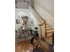 Open floorplan showcasing staircase with chandelier and dining table at 3552 Casalta Cir, New Smyrna Beach, FL 32168