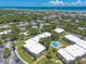 Scenic aerial view highlighting the community's proximity to the beach and lush surroundings at 3800 Saxon Dr # 180, New Smyrna Beach, FL 32169