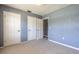 Bedroom with two closets providing ample storage and natural light at 3800 Saxon Dr # 180, New Smyrna Beach, FL 32169
