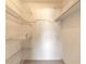 Walk-in closet with wire shelving and carpet flooring, providing ample storage space at 3800 Saxon Dr # 180, New Smyrna Beach, FL 32169