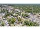 Expansive aerial view of a home centrally located within a vibrant community near various amenities at 402 N Orange St, New Smyrna Beach, FL 32168