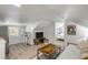 Finished attic featuring a kitchenette and a cozy living area with a view into another room at 402 N Orange St, New Smyrna Beach, FL 32168