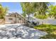 Spacious backyard featuring stairs, grill, outdoor seating, deck, and mature trees at 402 N Orange St, New Smyrna Beach, FL 32168