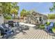 Outdoor patio area with grill, ample seating, and private backyard at 402 N Orange St, New Smyrna Beach, FL 32168