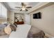 Bedroom featuring a ceiling fan, carpeting and window at 402 N Orange St, New Smyrna Beach, FL 32168