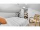 Comfortable bedroom boasts bright, natural light and a rocking chair at 402 N Orange St, New Smyrna Beach, FL 32168