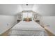 Cozy bedroom featuring string lights, two side tables, and a stylish decorative pillow set at 402 N Orange St, New Smyrna Beach, FL 32168