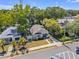 Charming exterior view of a well-maintained home with a cozy front porch and a neatly manicured lawn at 402 N Orange St, New Smyrna Beach, FL 32168