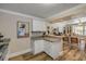 Kitchen leading into an open-plan living space, perfect for entertaining guests at 402 N Orange St, New Smyrna Beach, FL 32168