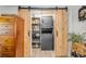 A stackable washer and dryer are tucked behind sliding barn doors at 402 N Orange St, New Smyrna Beach, FL 32168