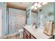 Nautical-themed bathroom with a single sink, vanity, and shower featuring a starfish curtain at 406 Phillips Creek Ln, New Smyrna Beach, FL 32168