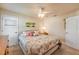 Relaxing bedroom with a decorative tropical theme, neutral decor, and plush carpeting, perfect for rest at 406 Phillips Creek Ln, New Smyrna Beach, FL 32168